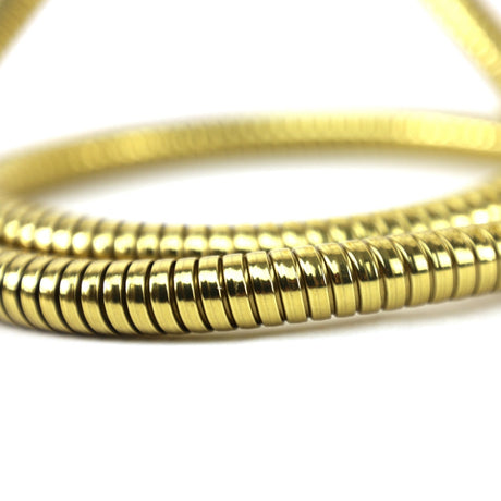 Golden retriever puppy playing with a ball